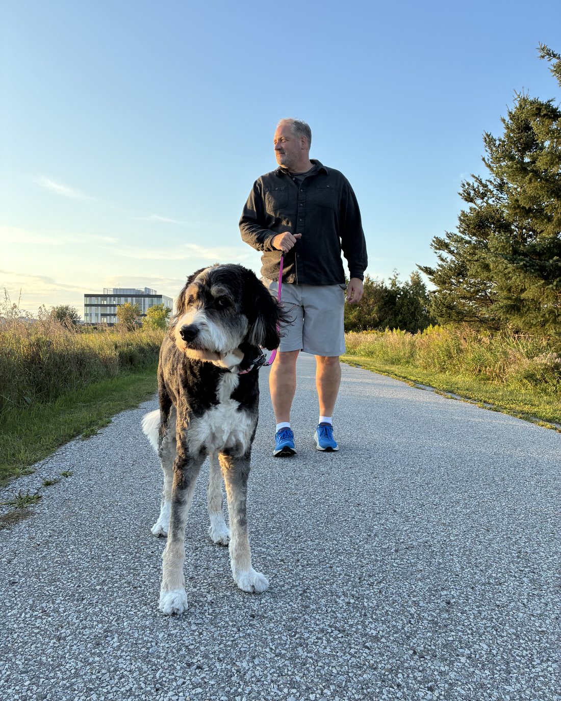 Erik Gordon walking his dog on a trail in Whitchurch-Stouffville